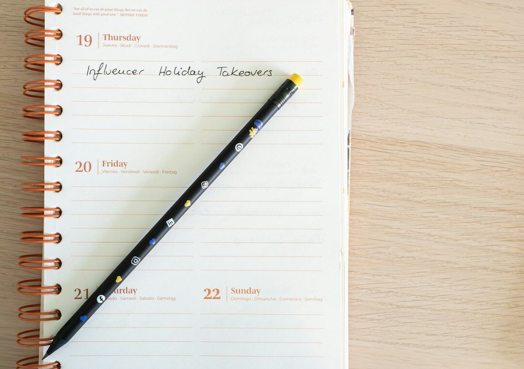 Open notebook with handwritten notes and a pen on a desk